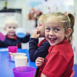 laughing-pupil-at-table