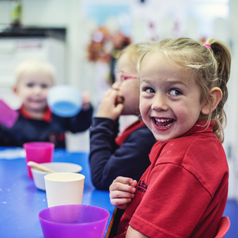 laughing-pupil-at-table